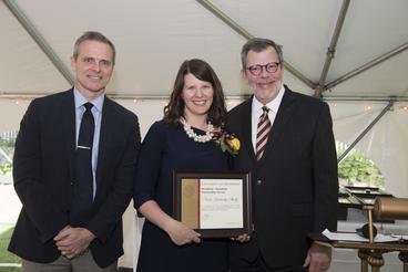 Nicole Letawsky Schultz poses with President Eric Kaler and Professor Robert Geraghty, chair of the President's Award for Outstanding Service Committee.Letawsky Schultz is holding her certificate.