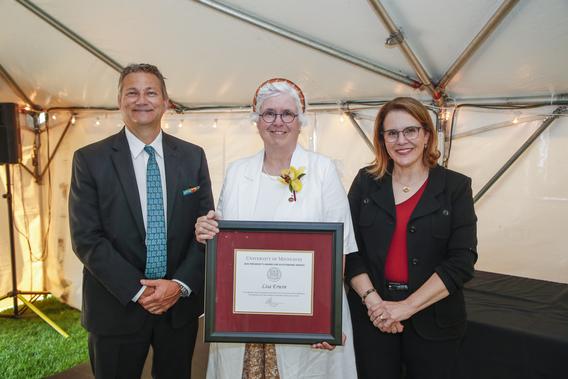 Photo of Lisa Erwin with President Joan Gabel and Professor Mark Distefano, chair, President's Award for Outstanding Service Committee
