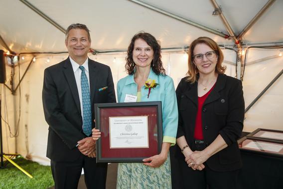 Photo of Christine Gallup with President Joan Gabel and Professor Mark Distefano, chair, President's Award for Outstanding Service Committee