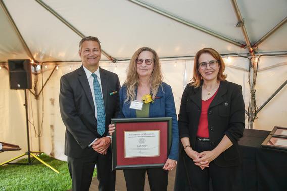 Photo of Katherine Hayes with President Joan Gabel and Professor Mark Distefano, chair, President's Award for Outstanding Service Committee