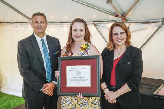 Photo of Kelsey Torgerson with President Joan Gabel and Professor Mark Distefano, chair, President's Award for Outstanding Service Committee